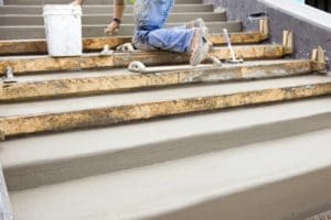 a person is making steps from concrete products